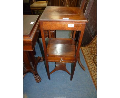 A Georgian Mahogany Campaign Night Table standing on square legs united by a shaped lower stretcher and a mid height shelf wi