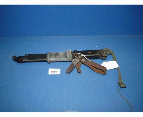 A German AK47 Bayonet with belt loop and wire cutting tool.