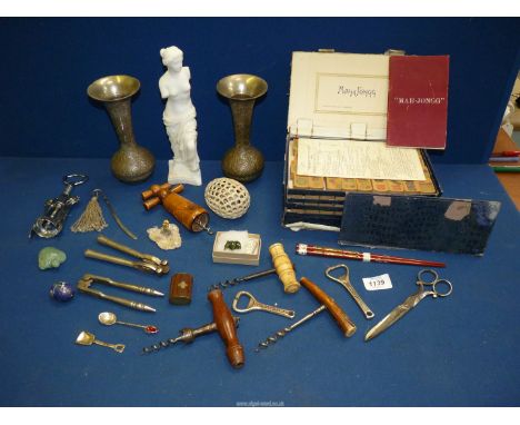 A quantity of cork openers and two plated vases with a marble like statue and a box game of Mahjong.