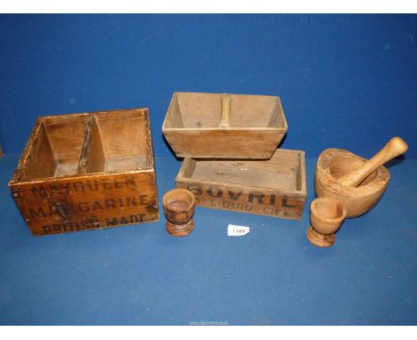 A quantity of treen including advertising boxes 'May Queen Margarine' and 'Bovril', turned pestle and mortar and two egg cups