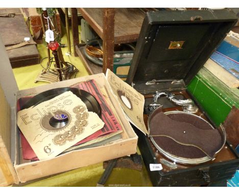 A 'His Masters Voice' Record player, with records.