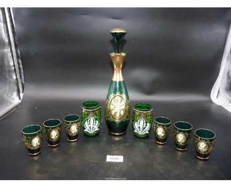 A vintage Bohemian green glass decanter set with six glasses plus two tumblers in similar pattern.