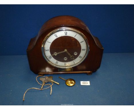A Westminster chiming Mantle Clock by The Alexander Clark Co. Ltd. with presentation plaque, having key and pendulum.