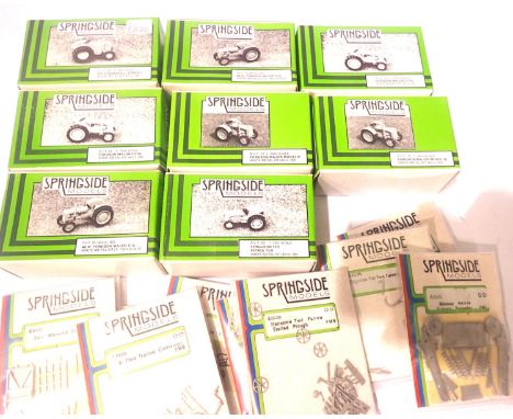 Eight Springside white metal tractor kits OO scale, and ten farming accessories kits. P&amp;P Group 2 (£18+VAT for the first 