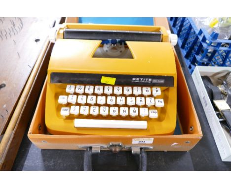 Cased Petite International Deluxe travel typewriter