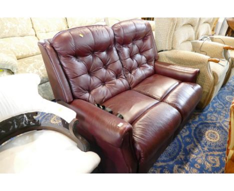 Deep button backed oxblood settee 