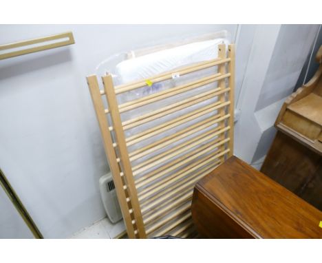 Unassembled child's cot 