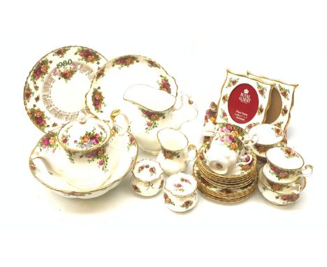 A Royal Old Country Roses teaset, comprising teapot, six teacups, six saucers, six side plates, milk jug, open sucrier, and c