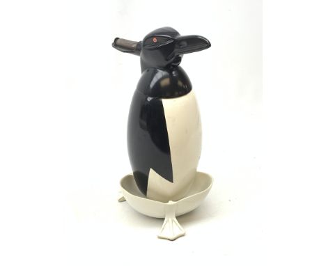 A Russian Soviet period soda siphon, modelled as an enamel penguin, and raised upon a plastic drip tray, H35.5cm  - Condition