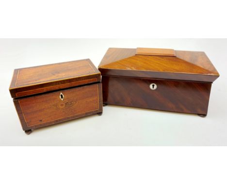  A 19th century mahogany tea caddy, of sarcophagus form and raised upon four bun feet, with inset mother of pearl escutcheon,