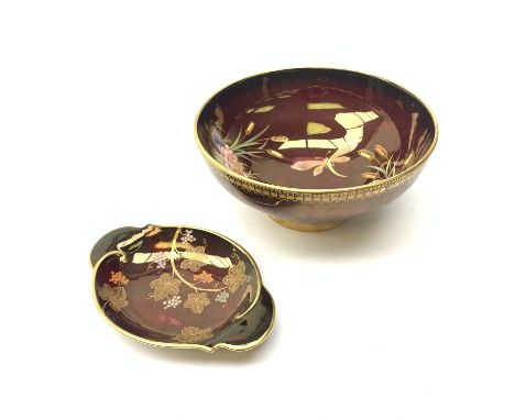 A large Carlton Ware Rouge Royale bowl, the interior decorated with dragonflies, lilies and bulrushes in enamel and gilt, wit