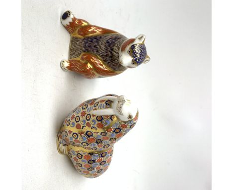 Two Royal Crown Derby paperweights, the first modelled as a Honey Bear, the second as a Walrus, each with print mark beneath,