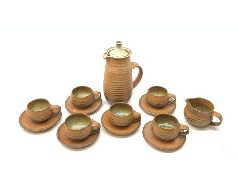 Glynn Hugo (b.1934), a studio pottery teaset, comprising tea pot, milk jug, six teacups, and six saucers.  - Condition Report