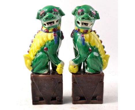 Pair of CHINESE PORCELAINE FOO dogs green and saffron yellow glazed book endsW: 2.5" approx  H: 6" approx Approx 2 piecesNo c