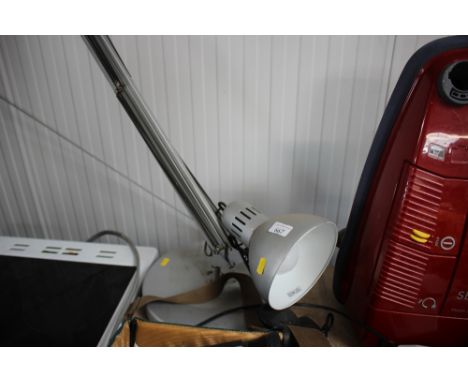 A floor standing angle poise style lamp
