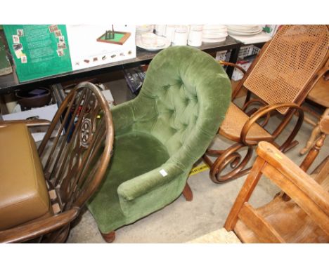 A green upholstered button back bedroom chair 