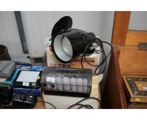 A set of Carmen hair rollers; and a health lamp