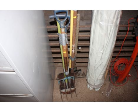 A quantity of long handled gardening tools