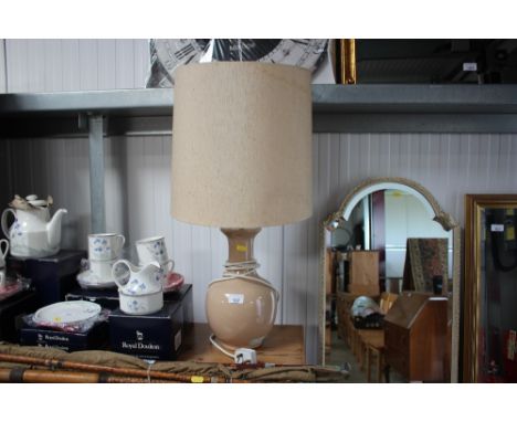 A glazed table lamp and shade