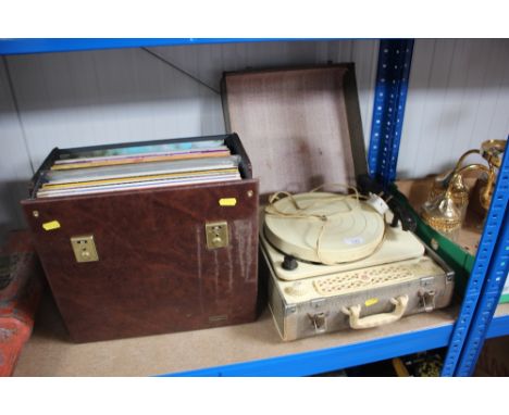 A Regentone turntable sold as collectors item; together with a case of LPs