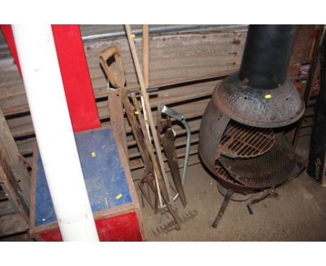 A quantity of long handled gardening tools