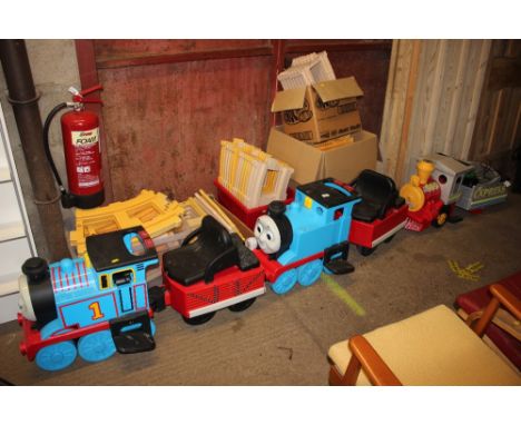 A self propelled Thomas the Tank Engine ride on toy with five boxes of track