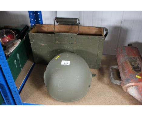 An ammo box and a military helmet