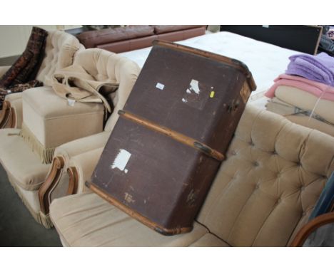 A wooden and metal bound travelling trunk