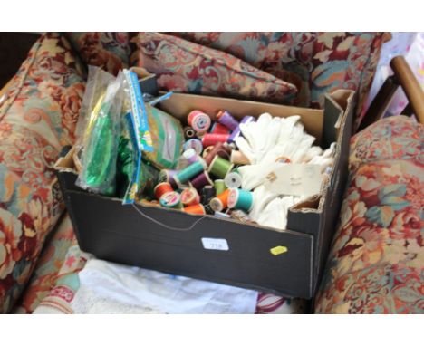 A box of various sewing related items and textiles 