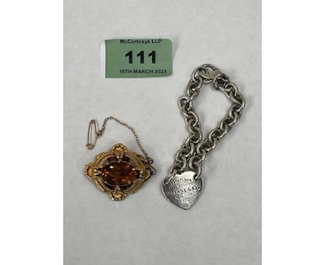 A Victorian citrine filigree brooch and a Tiffany &amp; Co silver heart and chain link bracelet