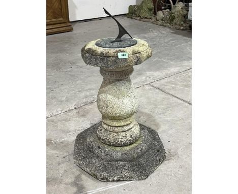 A sundial on baluster pedestal and octagonal base. 22' high excluding gnomon