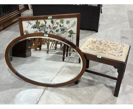 A mahogany stool with woolwork seat; an oval mahogany wall mirror and an embroidered mahogany firescreen. (3)