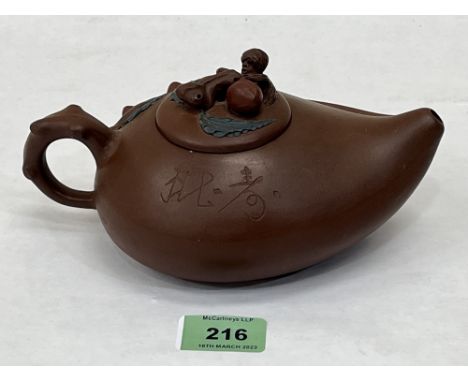 A Chinese Yixing Zisha clay teapot. 7¾' long over handle.  Seal mark to base