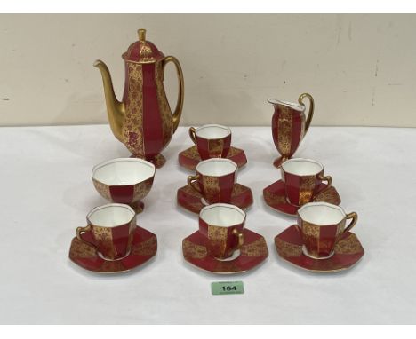 A Royal Doulton coffee service of octagonal form comprising a coffee pot, six cups and saucers a cream jug and sugar bowl (15