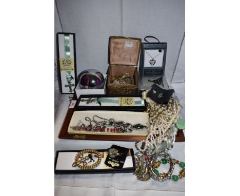 A selection of costume jewellery including vintage diamante necklaces, metal casket containing clip earrings, simulated pearl