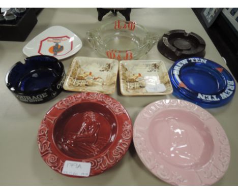 A selection of vintage advertising ashtrays including Carlesberg and Walkers Stout