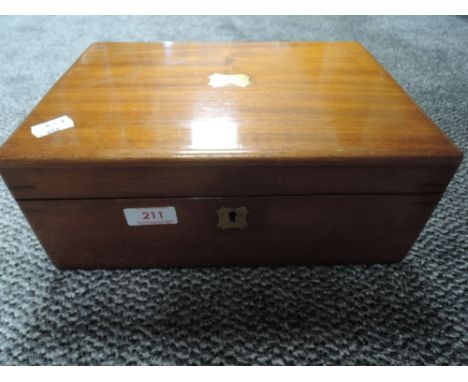 A solid mahogany cased writers compendium having twin inkwell included