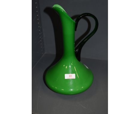 A vintage green glass jug.