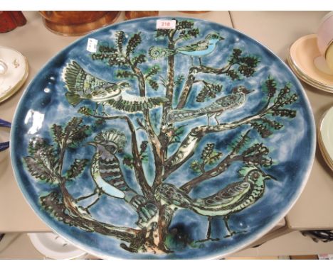 A large studio pottery charger by Poole having deep blue green hues with imagery of birds in tree
Approx 41.5cm, good conditi
