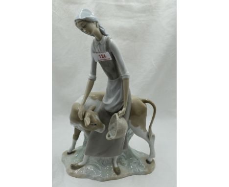 A ceramic figure study by Nao of Girl feeding Calf