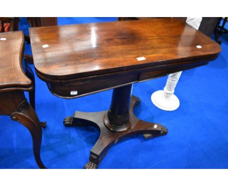 A 19th Century rosewood fold oover card table in William IV style with column support and platform base, width approx. 92cm