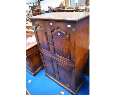 A nice qualty reproduction oak cocktail cabinet, by The Royal Oak Furniture Company, dimensions approx. H140 W86 D46cm