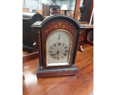 An Edwardian mahogany cased mantel clock having silvered dial , labelled to interior HAC Wurttemberg
