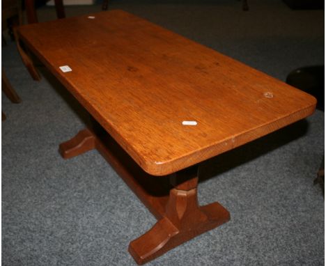 A Malcolm Foxman Pipes of Carlton Husthwaite adzed oak coffee table of refectory style with two octagonal turned supports, ca