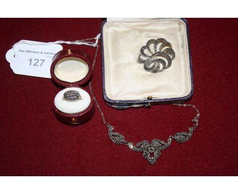 A marcasite necklace, a marcasite brooch and a marcasite ring (3)