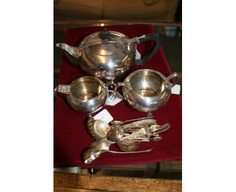 An Art Deco electroplated three piece tea service together with a quantity of electroplated tea and sifter spoons