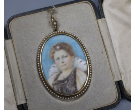 A yellow metal and seed pearl mounted oval portrait miniature of a lady, in leather case, 56mm.