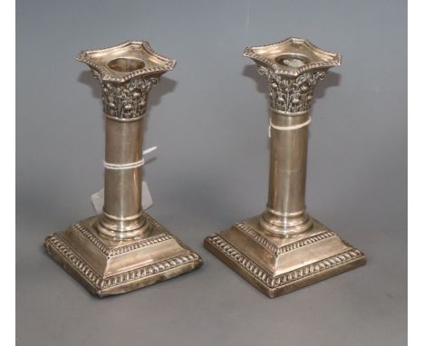 A pair of George V silver square based candlesticks, William Hutton &amp; Sons, Sheffield 1924, 14.1cm.