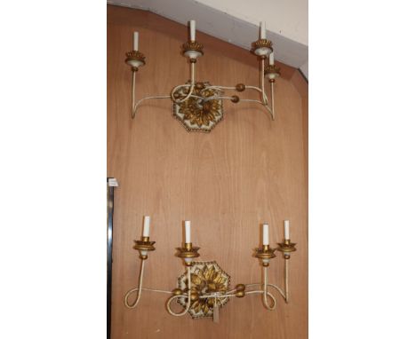 A pair of four light parcel gilt and cream wall brackets W.66cm
