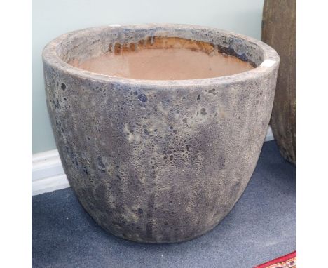 An 'Atlantis' circular garden planter